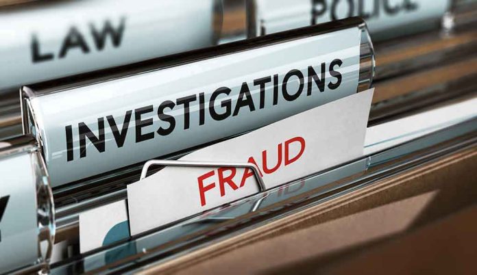 shutterstock_672511930 File folders labeled investigations and fraud in a filing cabinet