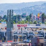 Underworld Super-Tunnel Exposes DC Blindspot Border crossing booths at Mexico entry point with cityscape in background