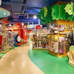 Asbestos Toys Pulled — Parents Stunned toy store aisle with colorful shelves and displays