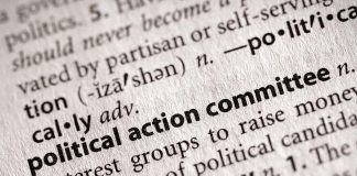 Close-up of a dictionary entry for political action committee