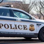 Secret Service Boss Reveals ‘MASSIVE’ Rise in Threats United States Secret Service police car on roadside.