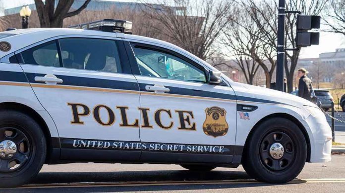 1606745311 United States Secret Service police car on roadside.