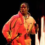 NYC Taxpayers Now FUNDING Aspiring Rappers Performer in a hoodie holding a microphone on stage