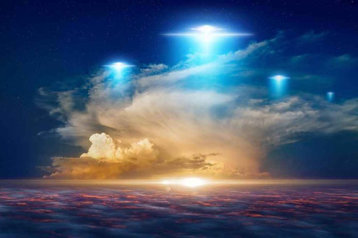 Glowing lights hover above dramatic sunset clouds over the ocean