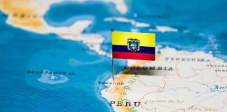 Ecuador flag pin on a map of South America