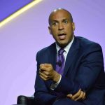 Cory Booker Gets SCHOOLED on Iran in Live Debate Cory Booker speaking on stage in a suit and tie