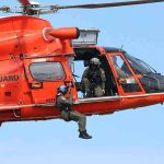 Missing Medical Jet Search Takes a GRIM Turn Rescue helicopter with crew performing hoist operation