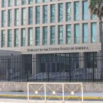 US Pulls Embassy STAFF Out of Saudi Arabia Embassy building behind tall black security fence