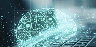 digital brain hologram over a laptop keyboard
