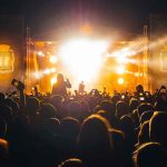 Country Star Sends a LOADED Stadium Message Crowd at a nighttime concert with bright stage lights