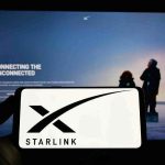 Why Major Phone Carriers Should FEAR Musk’s Starlink Smartphone showing Starlink logo in front of a computer screen