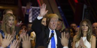 Donald Trump speaks at a rally with Ivanka Trump and Melania Trump on stage; Karlie Kloss in the crowd