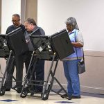 Judge BLOCKS Citizenship Checks on Voter Rolls Lester Bowie and Miriam Tlali using electronic voting machines at a polling place