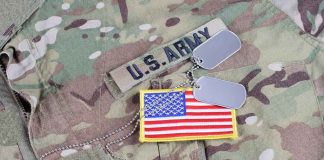 U.S. Army uniform with dog tags and American flag patch