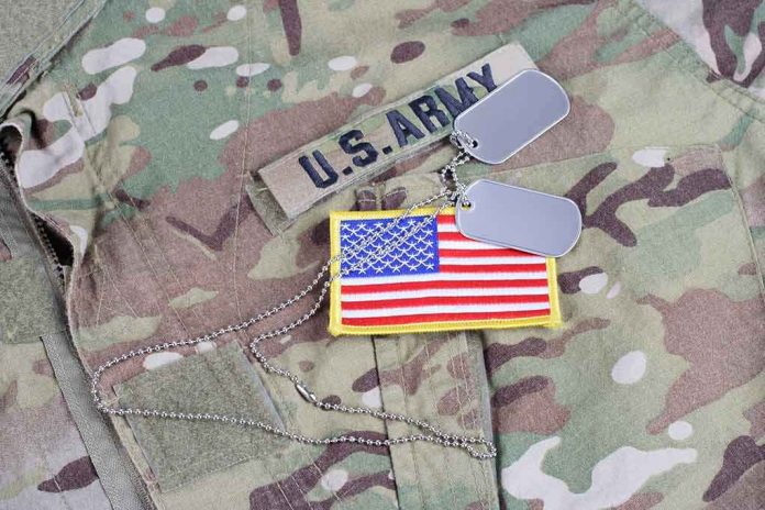 shutterstock_513453070 U.S. Army uniform with dog tags and American flag patch