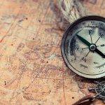 Why Conservatives Should Stand Up for COLUMBUS Compass on an old world map with rope and nautical charm